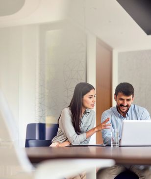 Businesswoman confidently working with team.