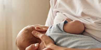 Baby feeding at the breast 