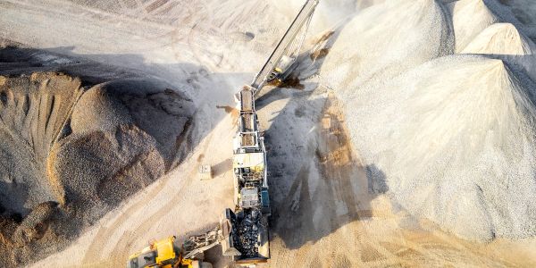 Quarry strategic management with heavy machinery and success message.