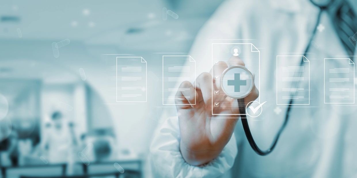 Doctor using digital health interface with stethoscope.