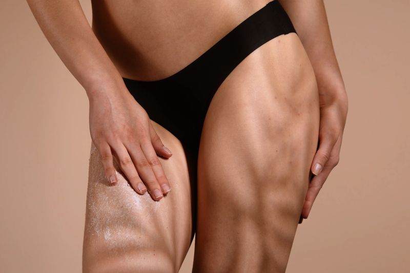 A close-up image showing the application of exfoliating product on skin for enhanced skincare routine.