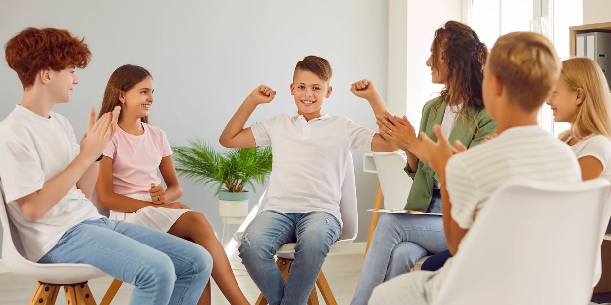 Multiple children with teachers sitting on the chair we discuss each other