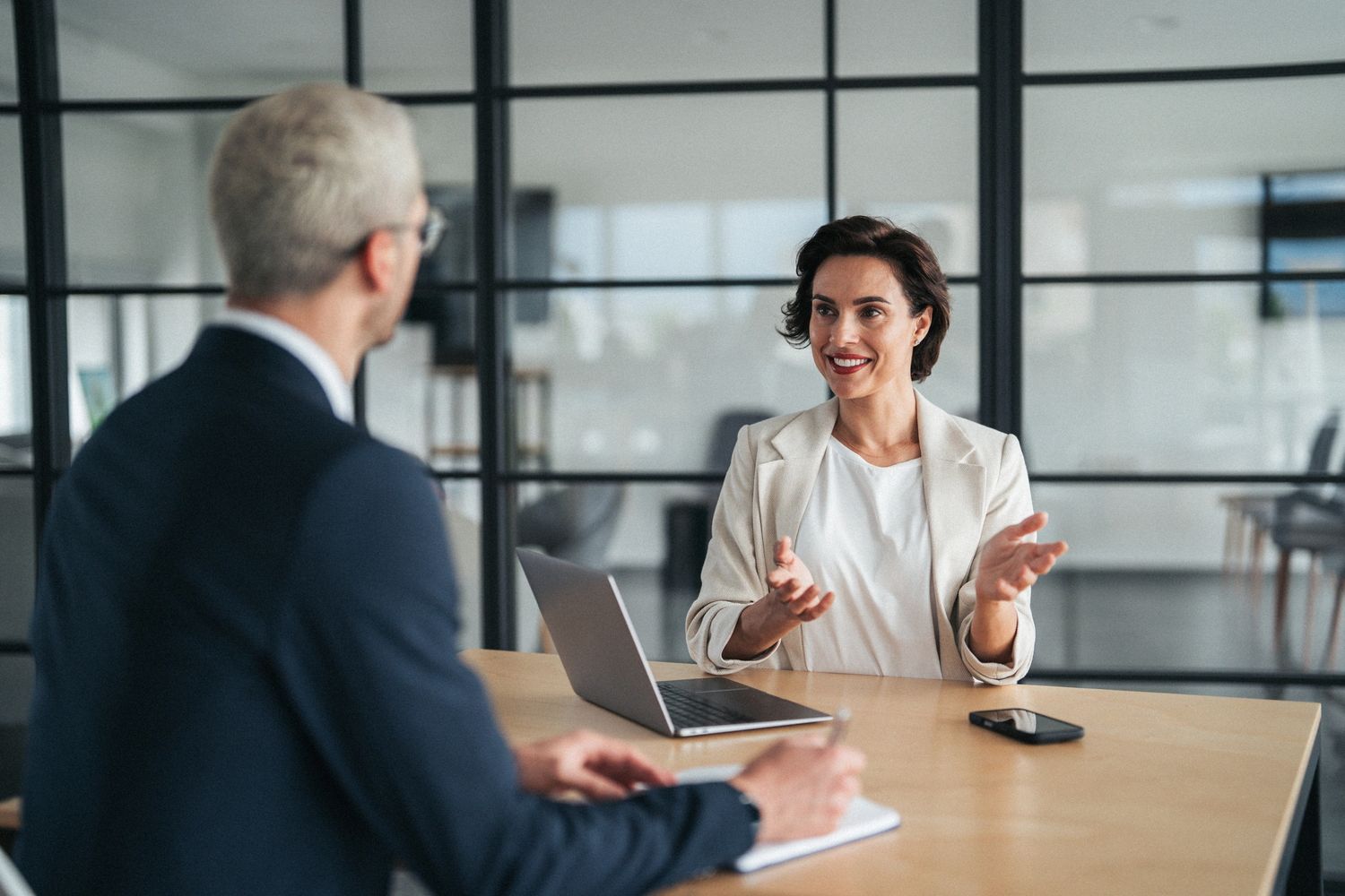 Business meeting with two professionals discussing.