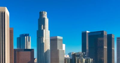 City skyline with modern commercial office buildings and skyscrapers.