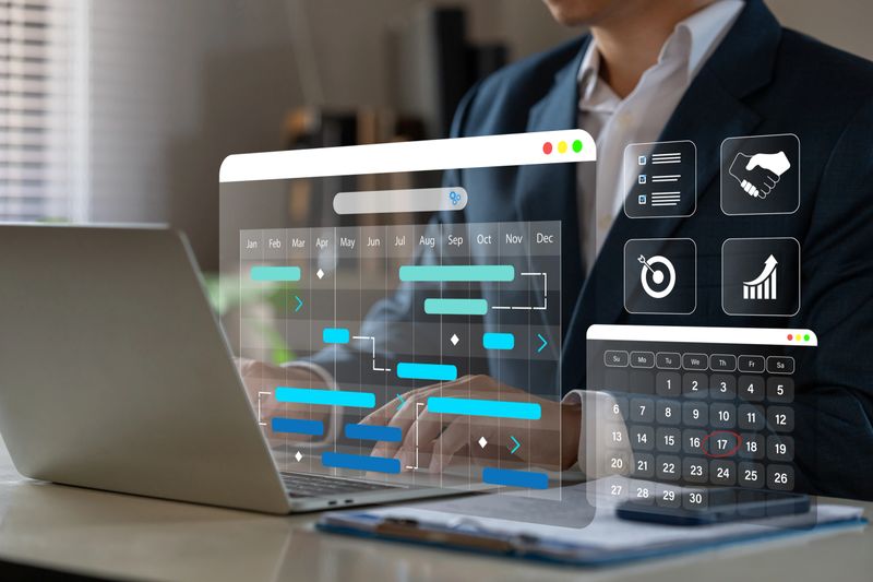 Project manager working with Gantt chart schedule to update the schedule, Management diagram with planning software on laptop screen.
