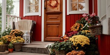 PIC OF RED EXTERIOR WOOD SIDING AND WOOD FRONT DOOR