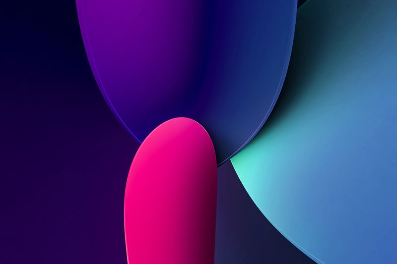 Abstract composition of smooth colorful shapes in blue, purple, and pink creating a vibrant modern background