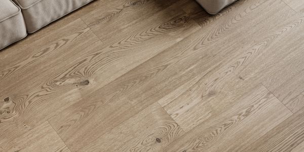 Light wooden floor with natural grain next to a beige couch.