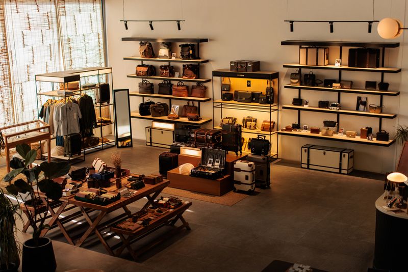 Sophisticated interior of a high-end boutique store in Dubai featuring designer clothing and accessories.