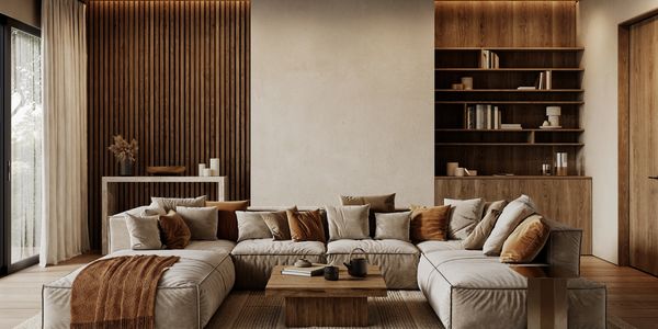 Cozy modern living room with beige sectional sofa and wooden accents.