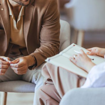 A therapist and patient in a counseling session.