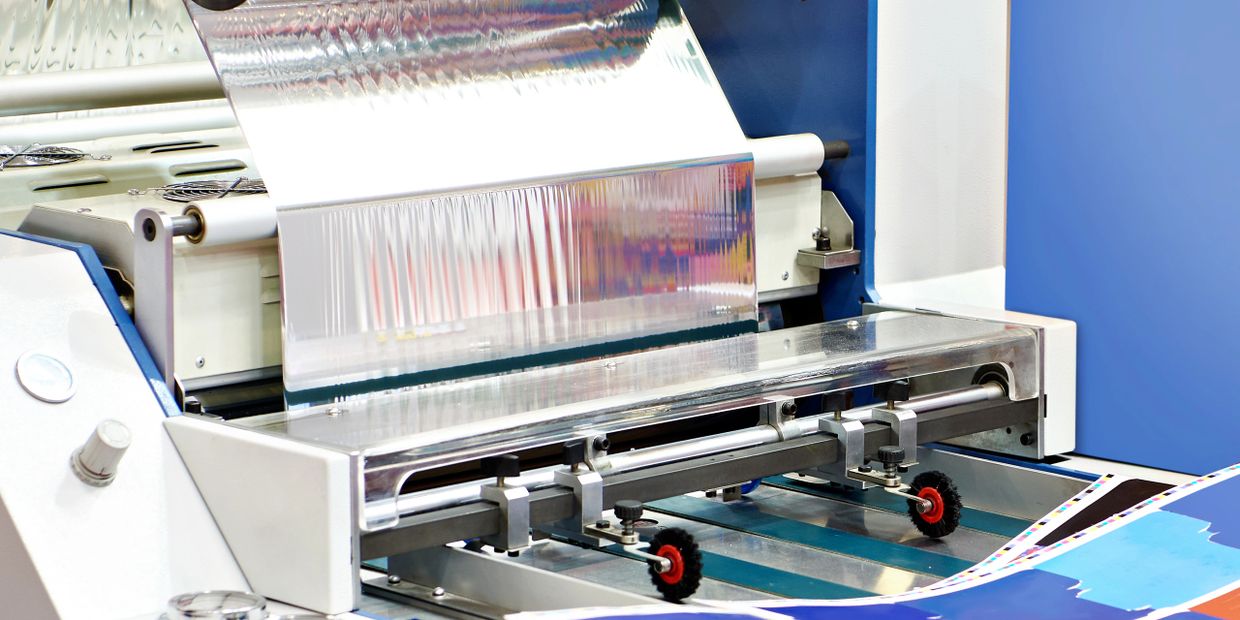 High-tech industrial printing machine producing colorful prints.