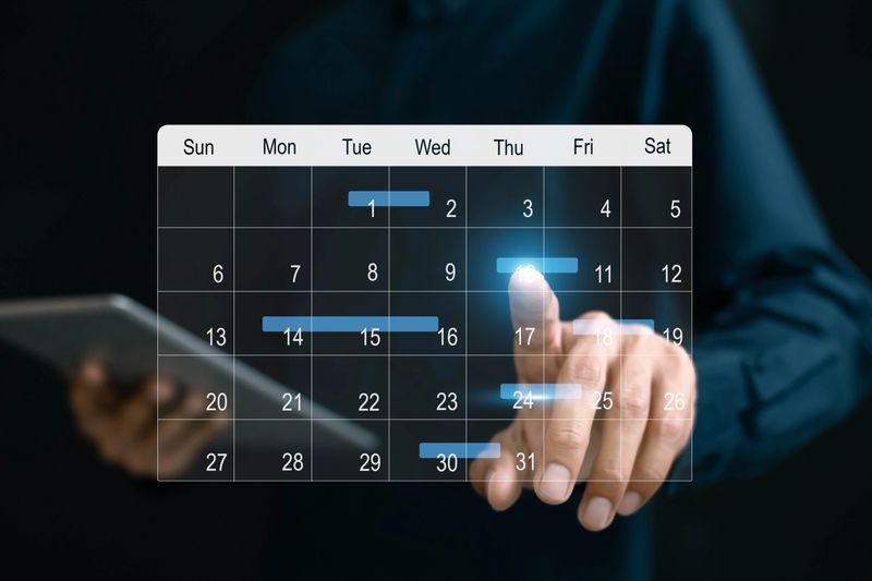 Businessman manages time for effective work. Calendar on the virtual screen interface, Businessman paste Post-it on important days on the calendar Important appointment dates