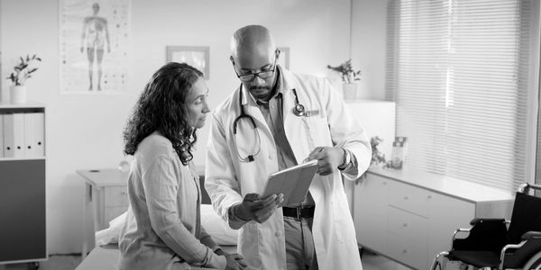 Doctor discussing medical information with patient.