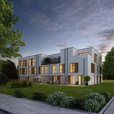 Modern three-story building with large windows at dusk.