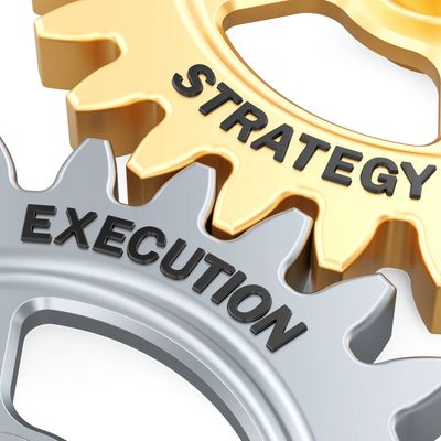 Two interconnected gears labeled 'Strategy' and 'Execution'.