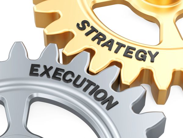Two gears labeled Strategy and Execution interlock.