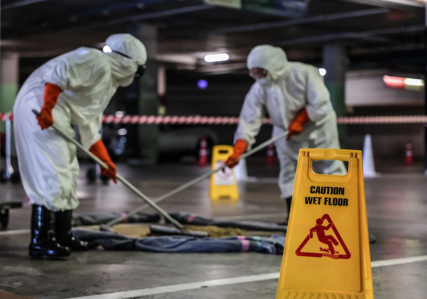 Stack of books next to pencils in a holder and a camera.