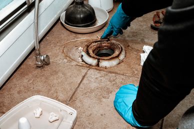 Proline Rooter technician working on a toilet installation for a broken toilet in an El Dorado Hills residence.