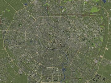 Satellite view of a city with ring roads.