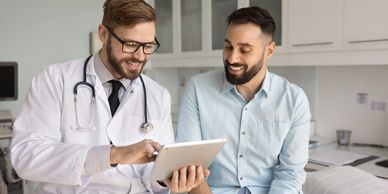 A doctor discussing a health plan with a male patient.