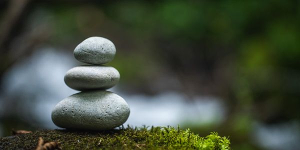 A cairn of rocks, symbolizing mindfulness skills you will learn by joining a DBT group