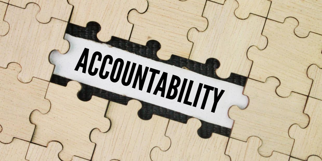 Puzzle piece missing with the word 'ACCOUNTABILITY' revealed underneath.