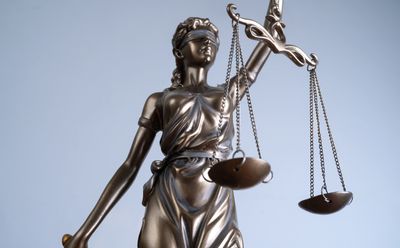 Statue of Lady Justice holding scales.