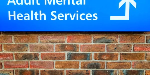 Sign pointing to Adult Mental Health Services.