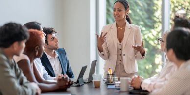 Businesswoman leading a meeting in a conference room.