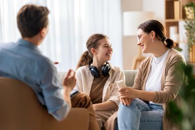 ADHD Coach supporting a parent and their child with practical ADHD strategies.