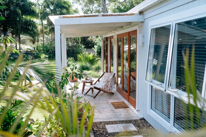 small bungalow accomodation with lush green gardens