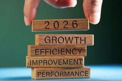 Wooden blocks stacked with business growth concepts and 2026 on top.