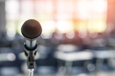 Close-up of a microphone in an empty room.