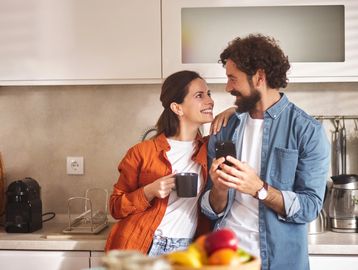 Happy couple participating in relationship therapy, improving communication and connection in Denver