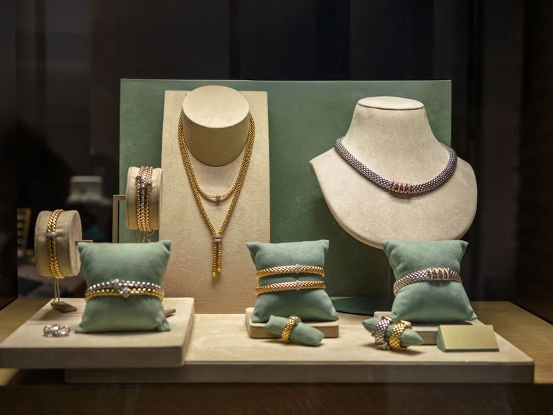 Assortment Of Necklaces Earrings And Bracelets Displayed In Shop Window.
