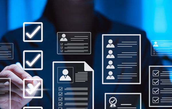 Person interacting with digital checklists and profiles in a futuristic interface.