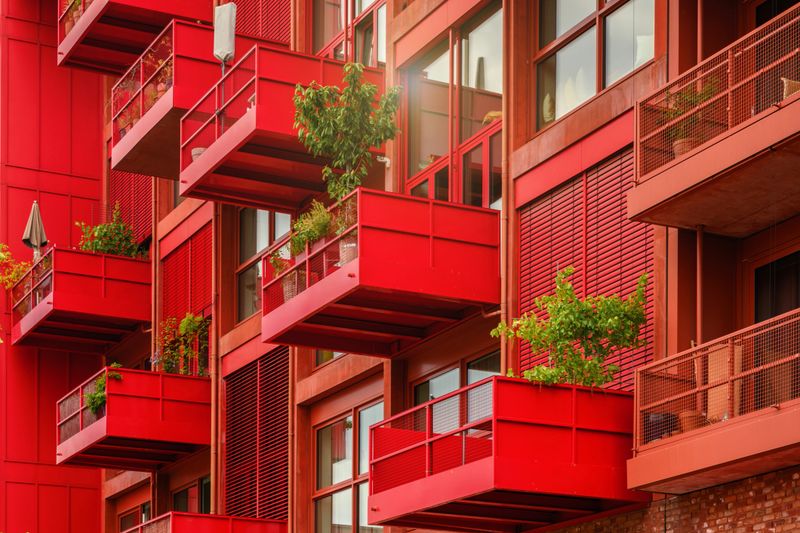 green plants on red balconies of modern residential architecture  in Berlin