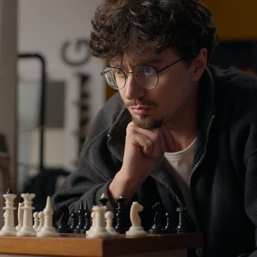 Man concentrating on a chess game.