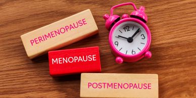 Blocks labeled perimenopause, menopause, postmenopause, and a pink alarm clock.
