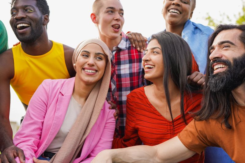 Group of multiracial young people having fun together at city park - Party, summer and lifestyle concept
