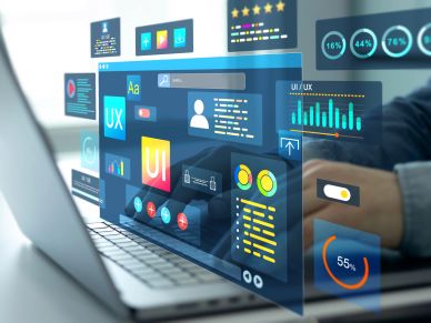 Person working on a laptop with virtual UI/UX design overlays.