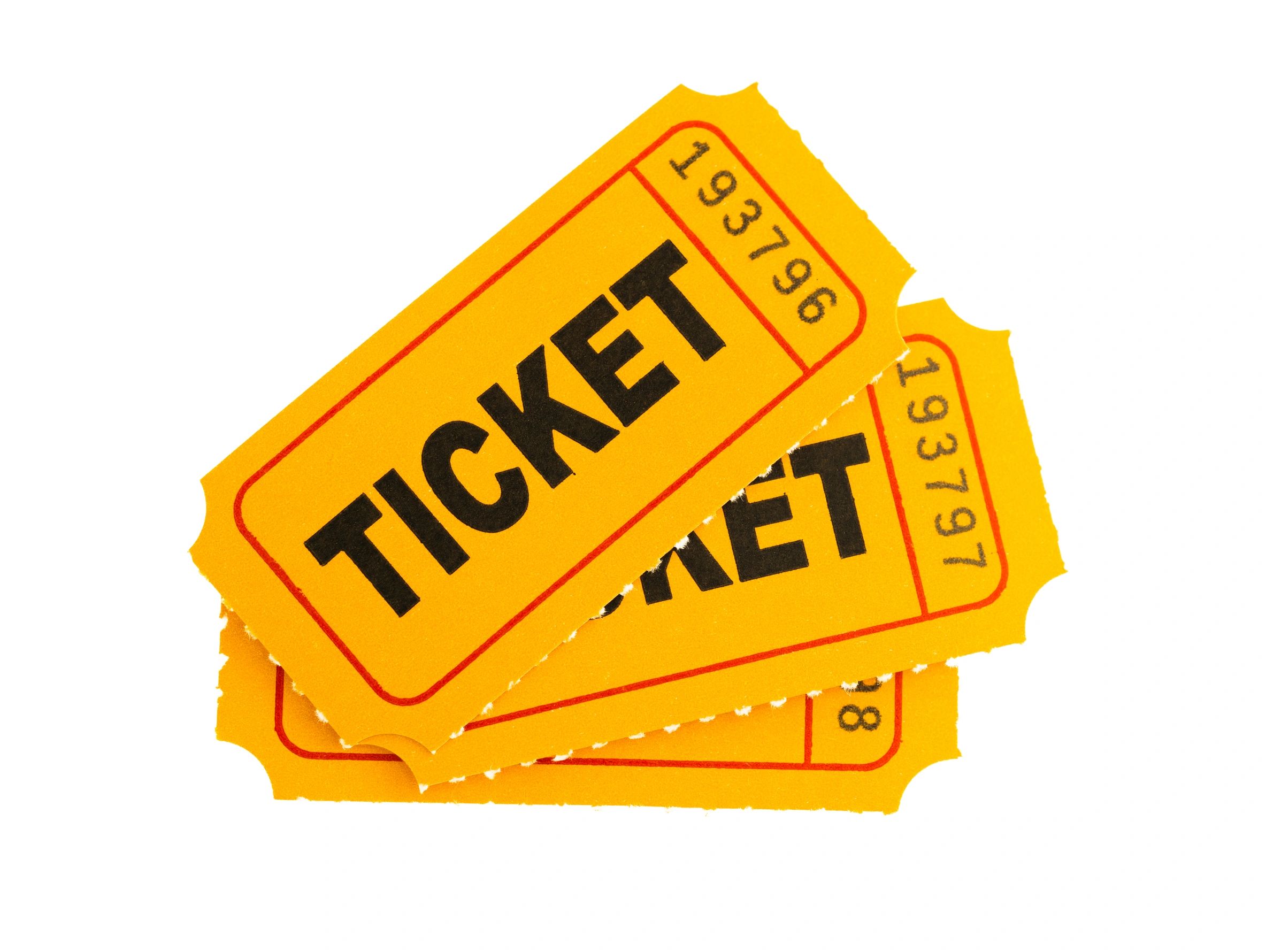 Bright yellow event tickets stacked on a white background.