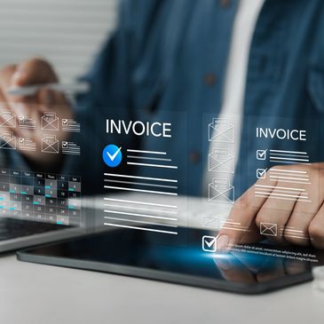 Person tracking solar project approvals and documents on a tablet and laptop.