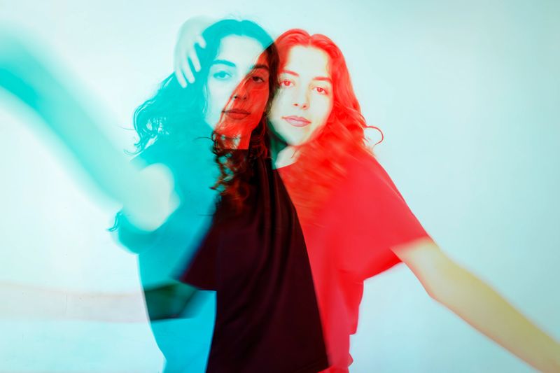 Portrait of a young woman in RGB color split effect style