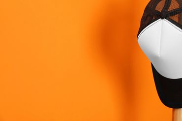 Vibrant cap featuring colorful embroidery and stars.