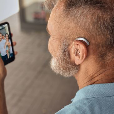 Image of a man with a behind-the-ear hearing aid.