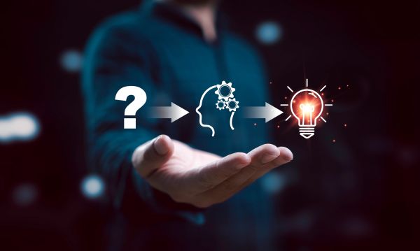 Hand showing a creative thinking process with icons.