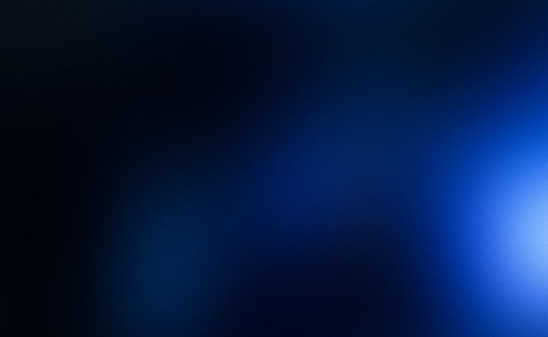 Noisy gradient black blue grainy blurred abstract dark background. Blue is the color commonly associated with harmony, confidence, masculinity, knowledge, intelligence, calm, distance, infinity, the imagination, cold and sadness. Black commonly associated with mourning, the end, secrets, magic, force, violence, fear, evil, and elegance.