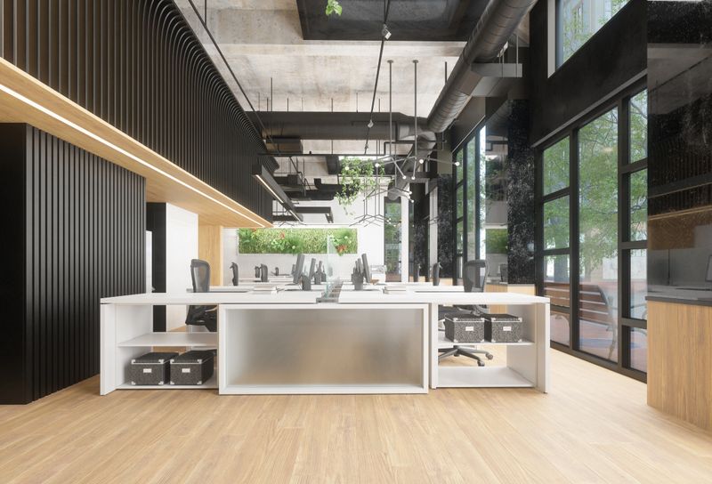 Clean modern office space with multiple workstations and green plants. Contemporary empty open-plan office interior with large windows. 3d render